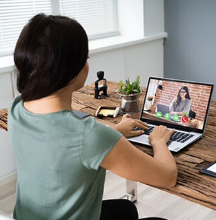 Image of girl working remotely in her home